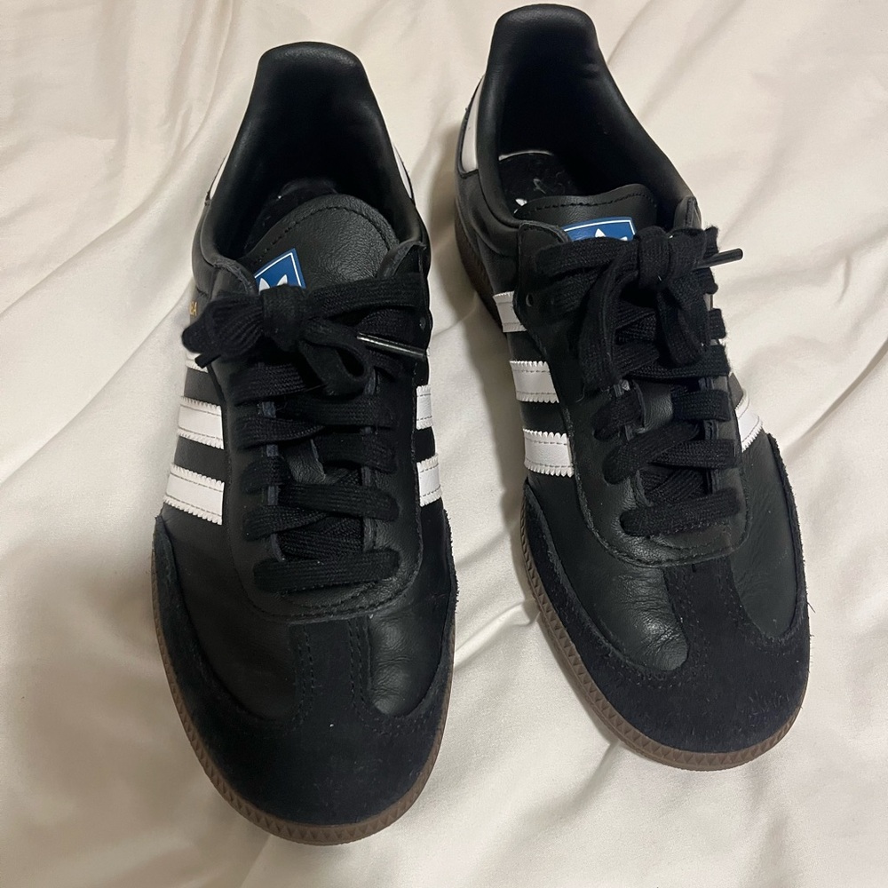 Adidas Women’s Black Sneakers with White Stripes